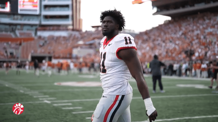 Jalon Walker in a football uniform on the field.