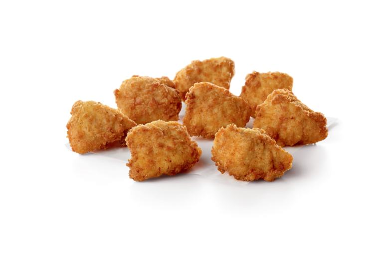 Eight crispy, golden-brown chicken nuggets on a white background.