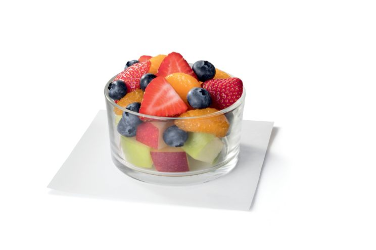 A fruit mix made with chopped pieces of red and green apples, mandarin orange segments, fresh strawberry slices, and blueberries.