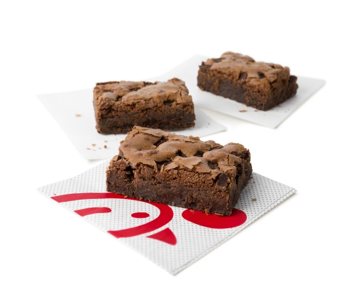 Three Chocolate Fudge Brownies on Chick-fil-A branded napkins.