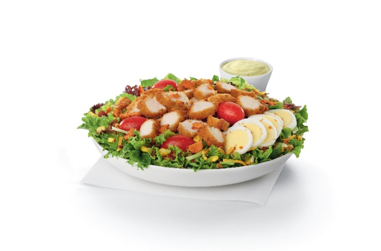 Chick-fil-A® Nuggets, sliced and served on a fresh bed of mixed greens, topped with roasted corn kernels, a blend of shredded Monterey Jack and Cheddar cheeses, crumbled bacon, sliced hard-boiled egg and grape tomatoes.
