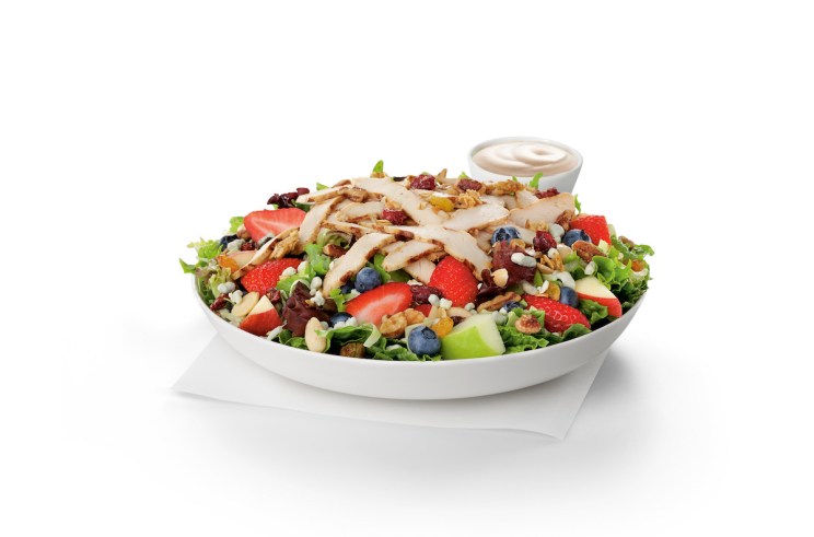 Sliced grilled chicken breast served on a fresh bed of mixed greens, topped with crumbled blue cheese and a mix of red and green apples, strawberries and blueberries. Served with Harvest Nut Granola and Roasted Almonds.
