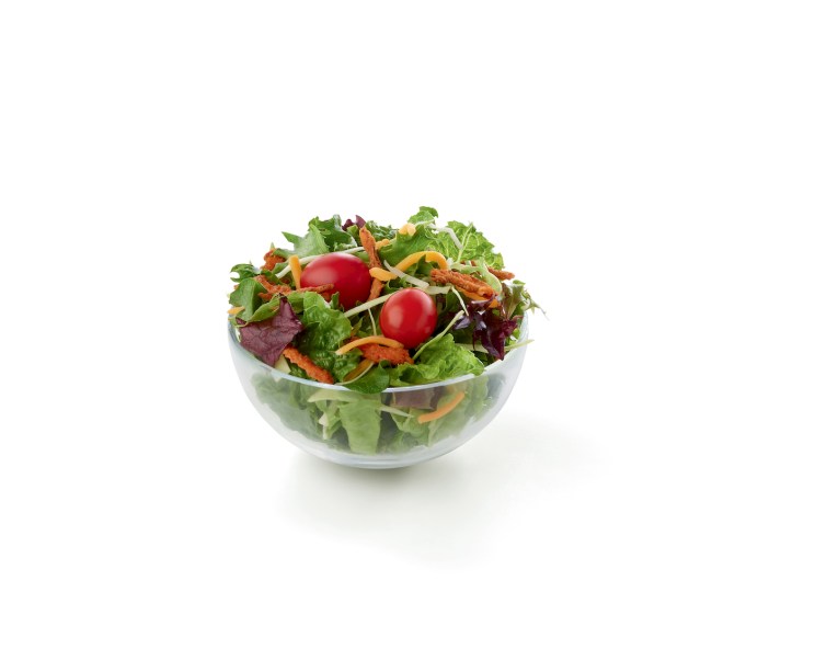 A fresh bed of mixed greens, topped with a blend of shredded Monterey Jack and Cheddar cheeses and grape tomatoes.