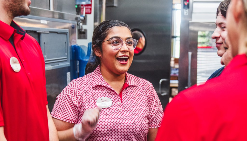 Restaurant Team Leader talking with other Team Members 