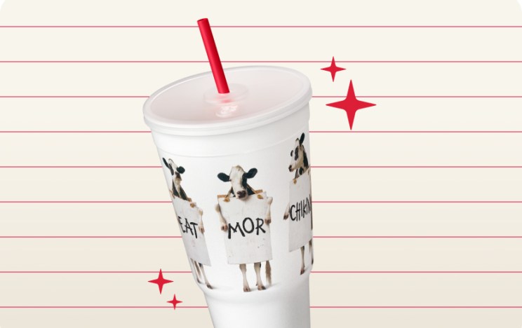 Cows Billboard Classic Cup with red stars around it on a cream striped background