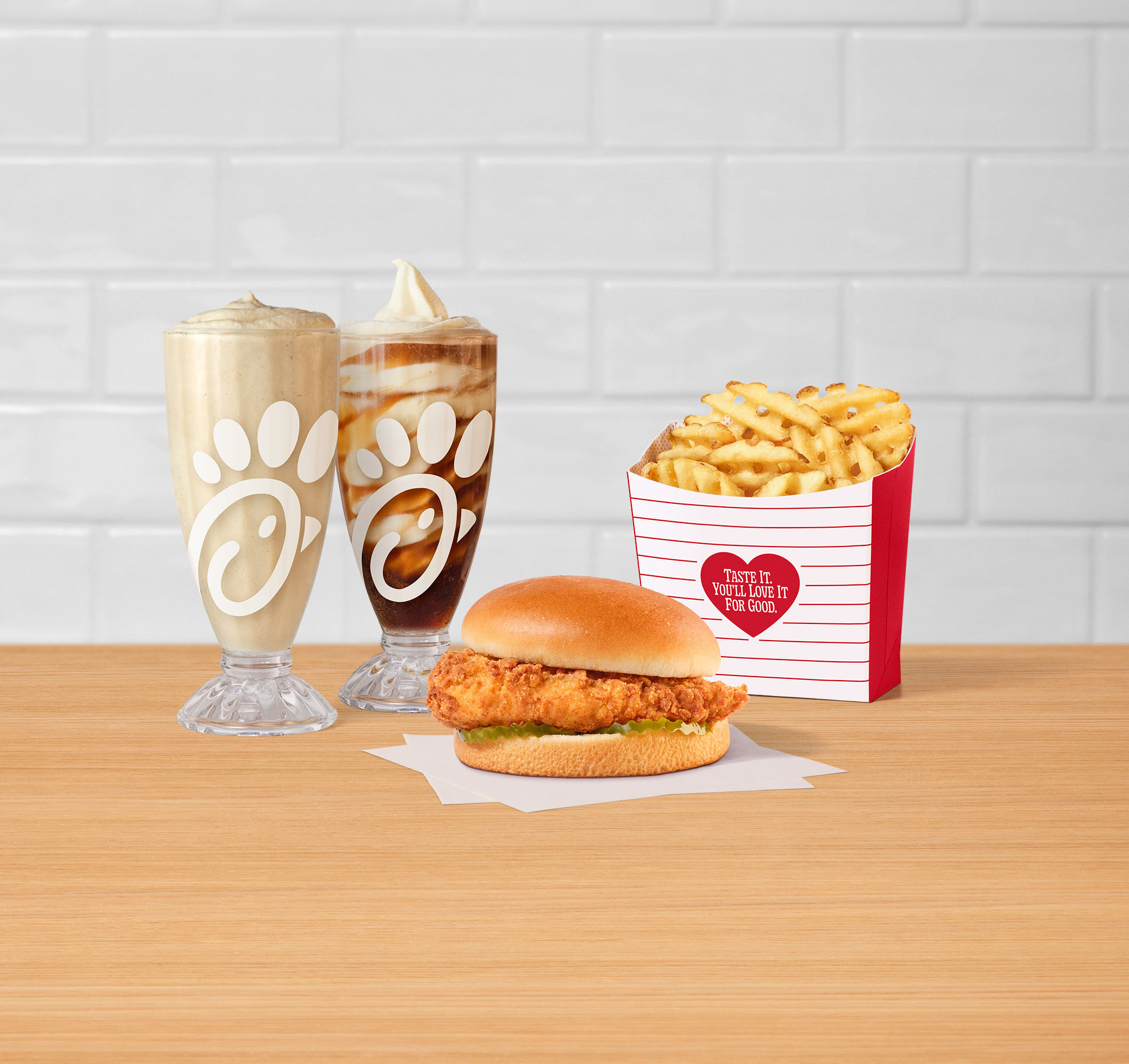 Chick-fil-A Chicken Sandwich featured with Waffle Fries, a Frosted Soda and Float.
