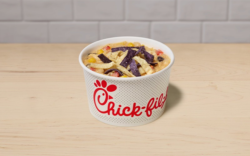 A bowl of Chicken Tortilla Soup on a table