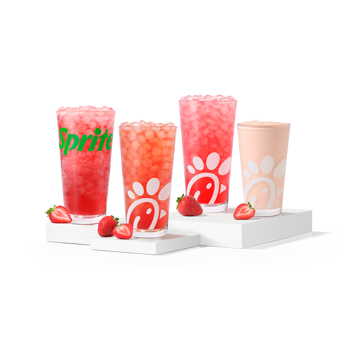Strawberry Hibiscus & Sprite®, Sunjoy®, Lemonade and Frosted Lemonade, made with natural strawberry and hibiscus flavors, sitting on risers with strawberry slices