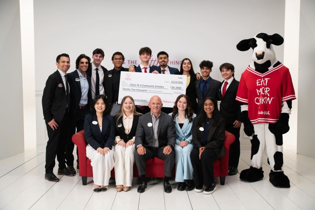 Chick-fil-A CEO Andrew Cathy seated alongside the 13 $25K Chick-fil-A Community Scholars for 2026.