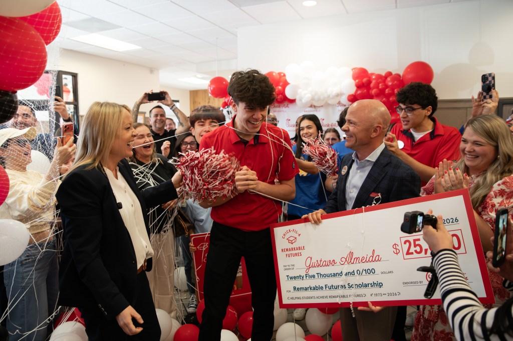 Chick-fil-A Team Member Gustavo Almeida receiving his $25K Remarkable Futures Scholarship.