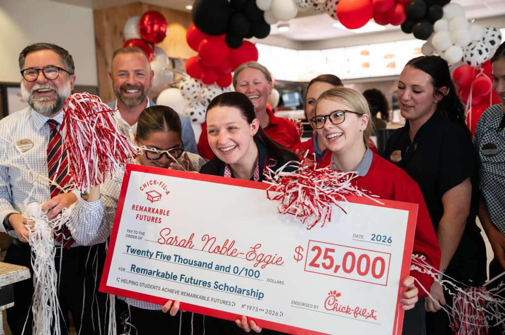 Chick-fil-A Team Member Sarah Noble-Eggie celebrating her reception of the $25K Remarkable Futures Scholarship with her fellow Team Members.