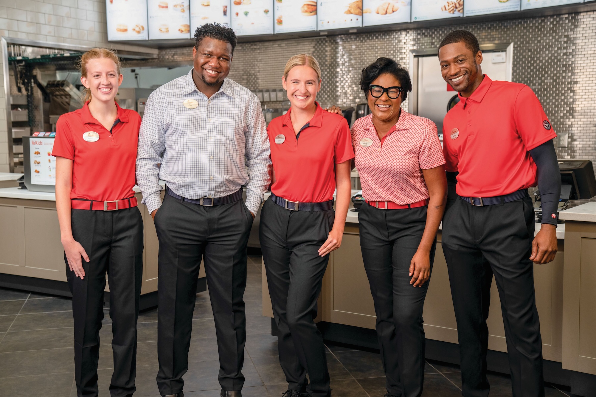 Chick-fil-A Team Members standing together posing in a line.