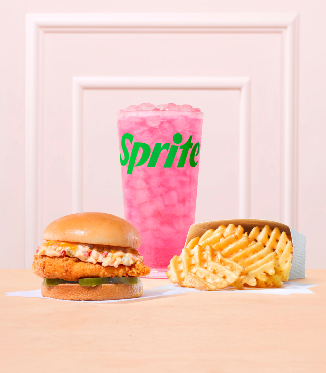 A Honey Pepper Pimento with an original filet with a side of Waffle Fries, and a Pineapple Dragonfruit & Sprite®