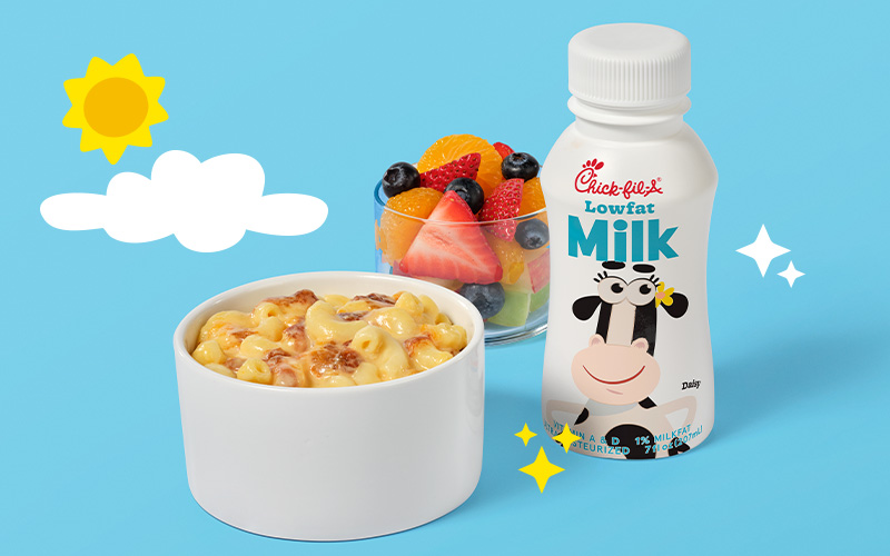 Mac & Cheese Kid’s Meal with milk and Fruit Cup on a blue background with a cloud and sun design