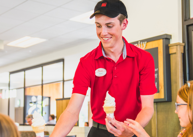 Team Member serving two children Icedream® Cones