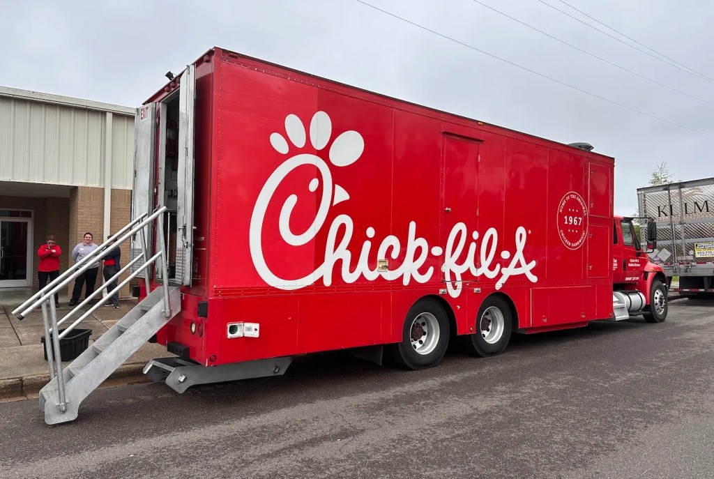 Chick-fil-A mobile kitchen parked outside a community facility.